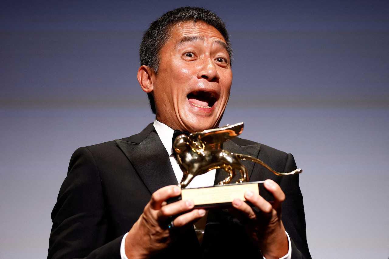 Actor Tony Leung Chiu-Wai reacts as he receives the Golden Lion Award for Lifetime Achievement at the The 80th Venice Film Festival in Venice, Italy, Sept 2. Photo: Reuters