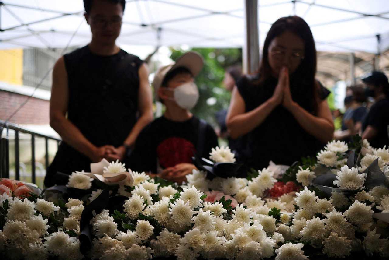 A family mourns in front of a classroom where a young teacher was found dead in July in an apparent suicide, at an elementary school in Seoul, South Korea, Sept 4. Photo: Reuters
