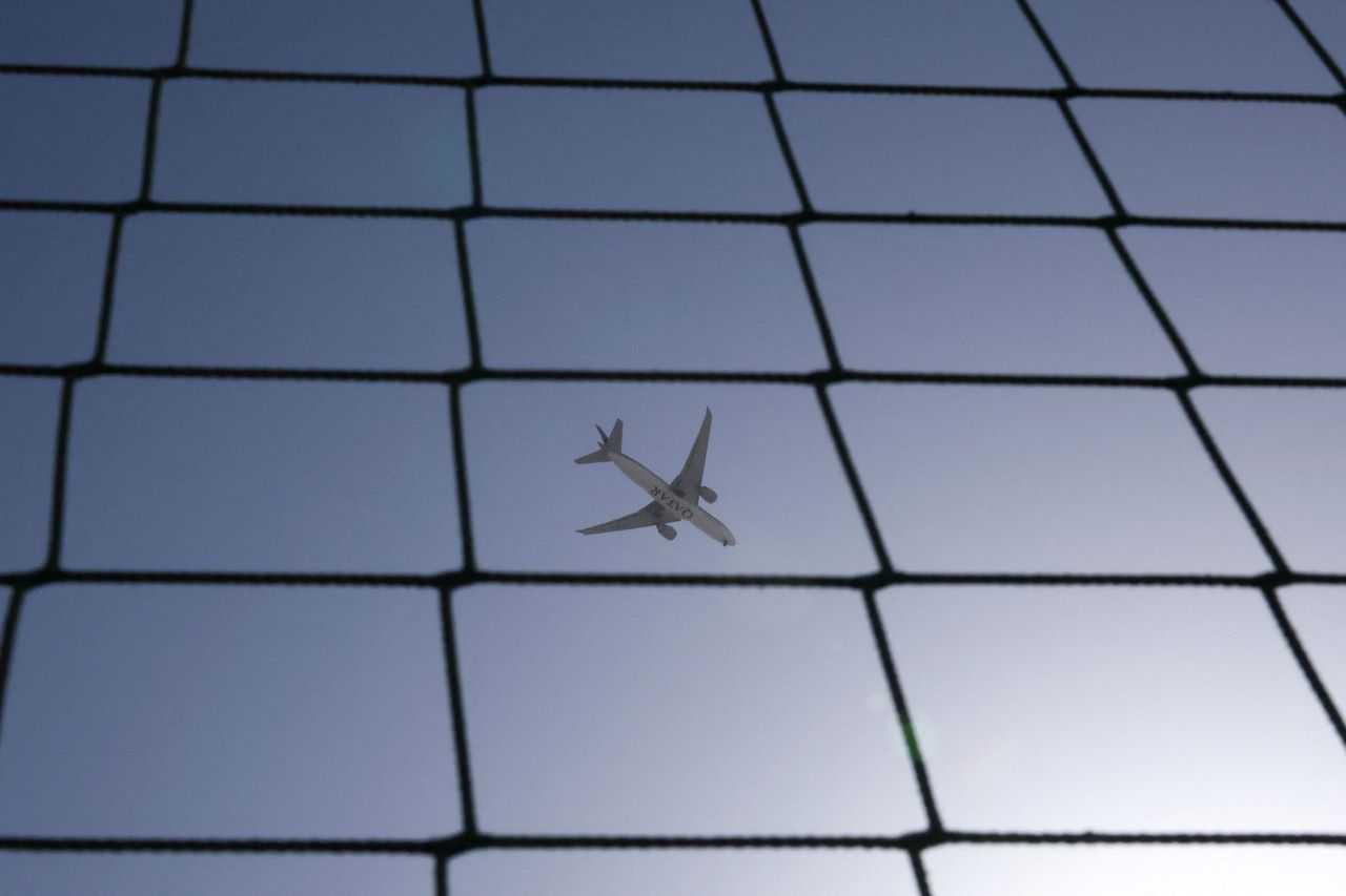 A Qatar Airways plane flies over Dubai, United Arab Emirates, Aug 20. Photo: Reuters