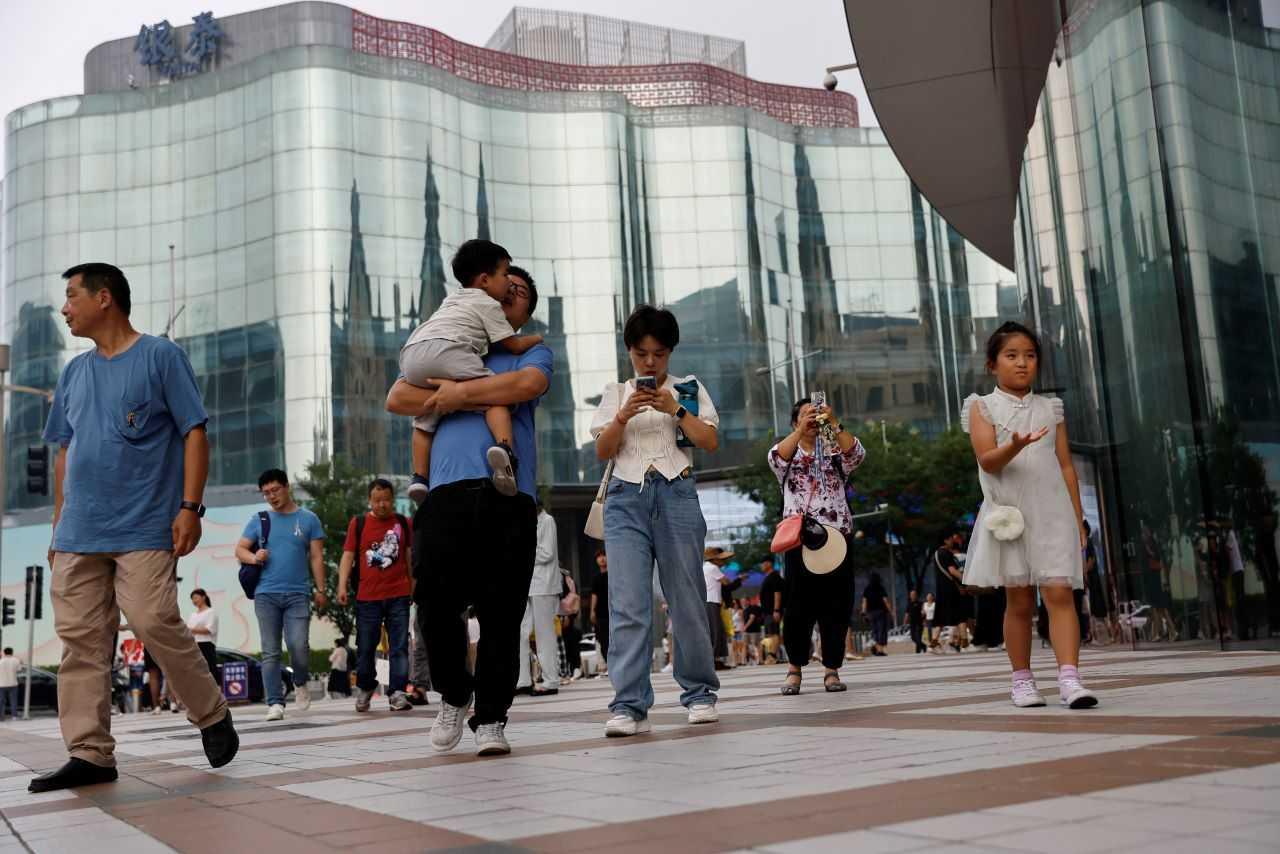 People walk at a shopping area in Beijing, China Sept 5. Photo: Reuters