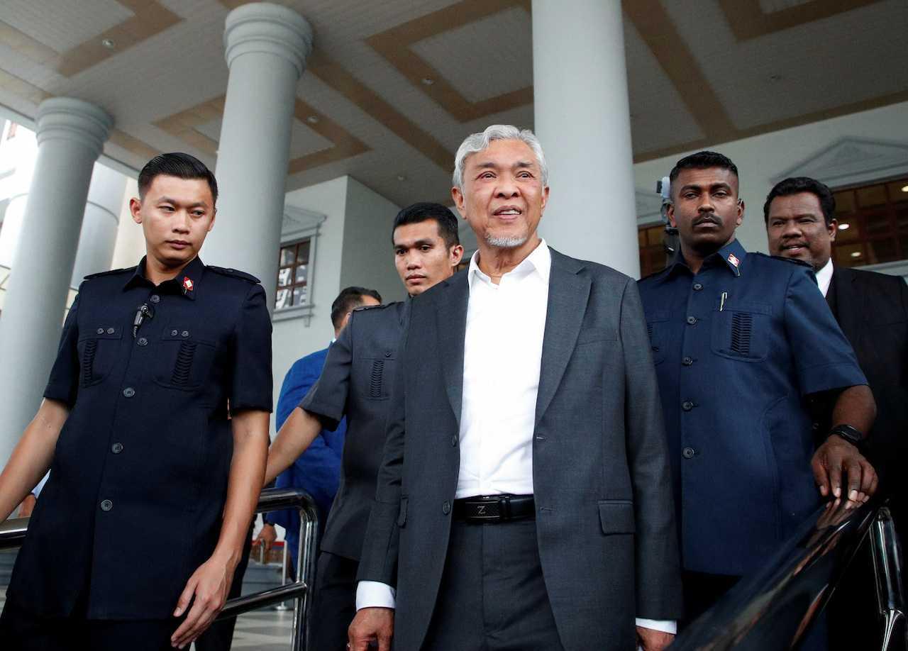 Deputy Prime Minister Ahmad Zahid Hamidi leaves the Kuala Lumpur court complex after the court dropped corruption charges against him, Sept 4. Photo: Reuters
