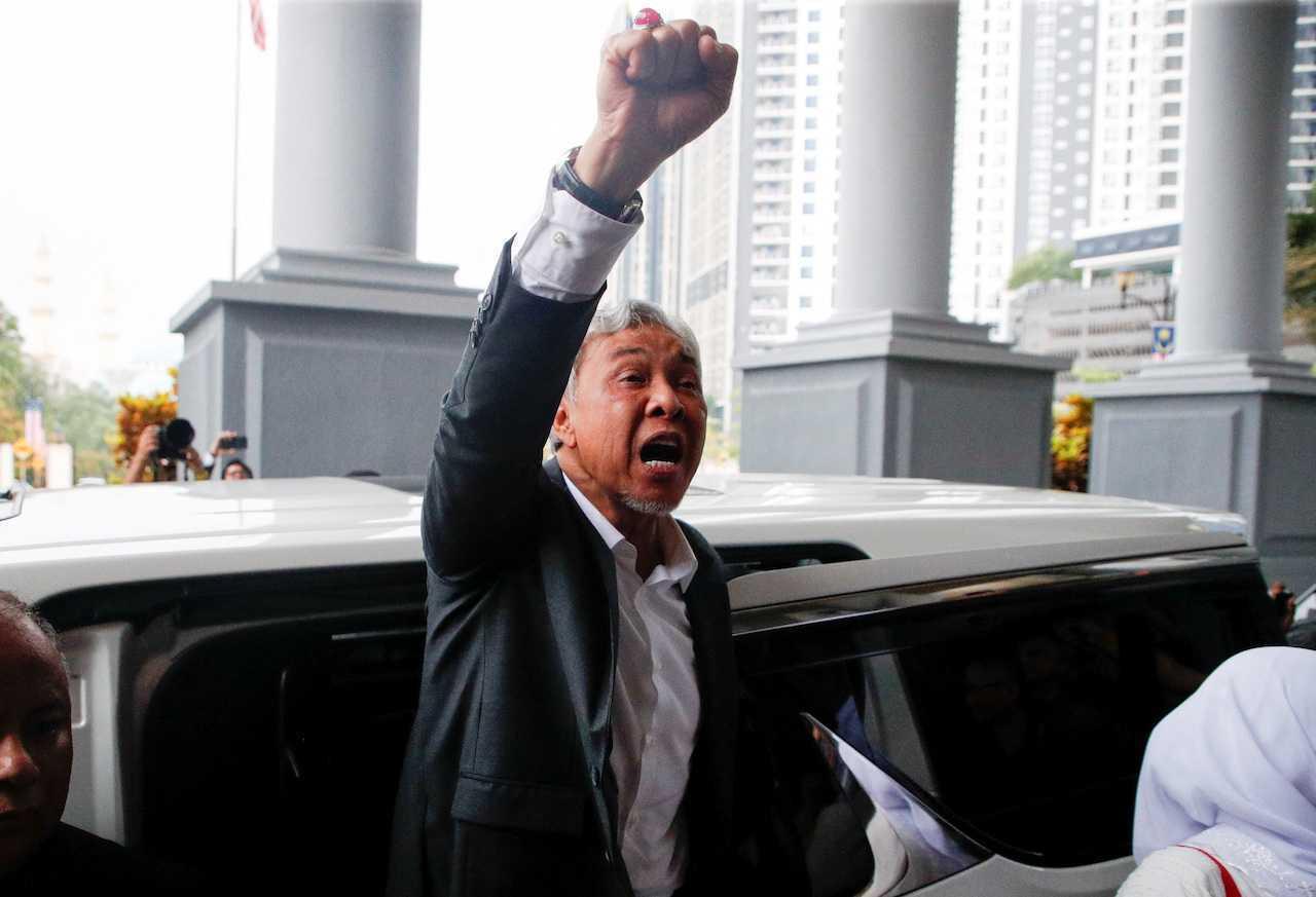 Deputy Prime Minister Ahmad Zahid Hamidi raises his fist as he leaves the Kuala Lumpur court complex, Sept 4. Photo: Reuters