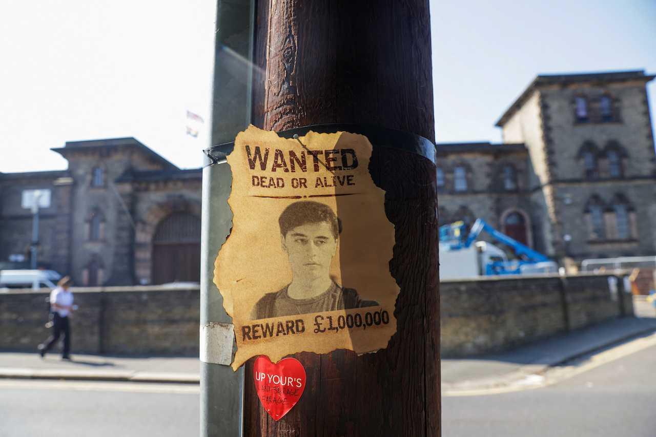 A wanted sign featuring an image of Daniel Abed Khalife, a former soldier suspected of terrorism offences, is displayed near Wandsworth prison which he escaped from, in London, Britain, Sept 7. Photo: Reuters