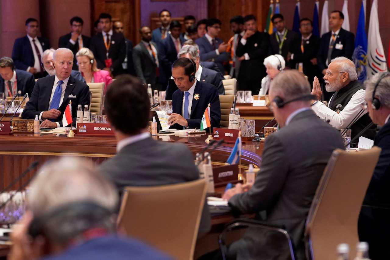 Indian Prime Minister Narendra Modi speaks as US President Joe Biden with other leaders listen during the first session of the G20 Summit, in New Delhi, India, Sept 9. Photo: Reuters