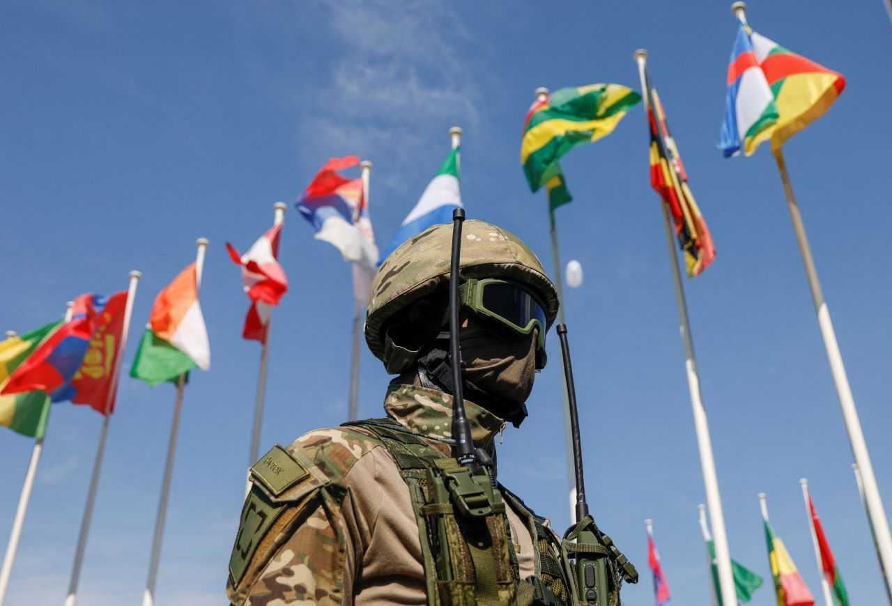 A mannequin displaying a uniform and equipment is placed in front of state flags at an exposition of the international military-technical forum Army-2023 at Patriot Congress and Exhibition Centre in the Moscow region, Russia, Aug 18. Photo: Reuters