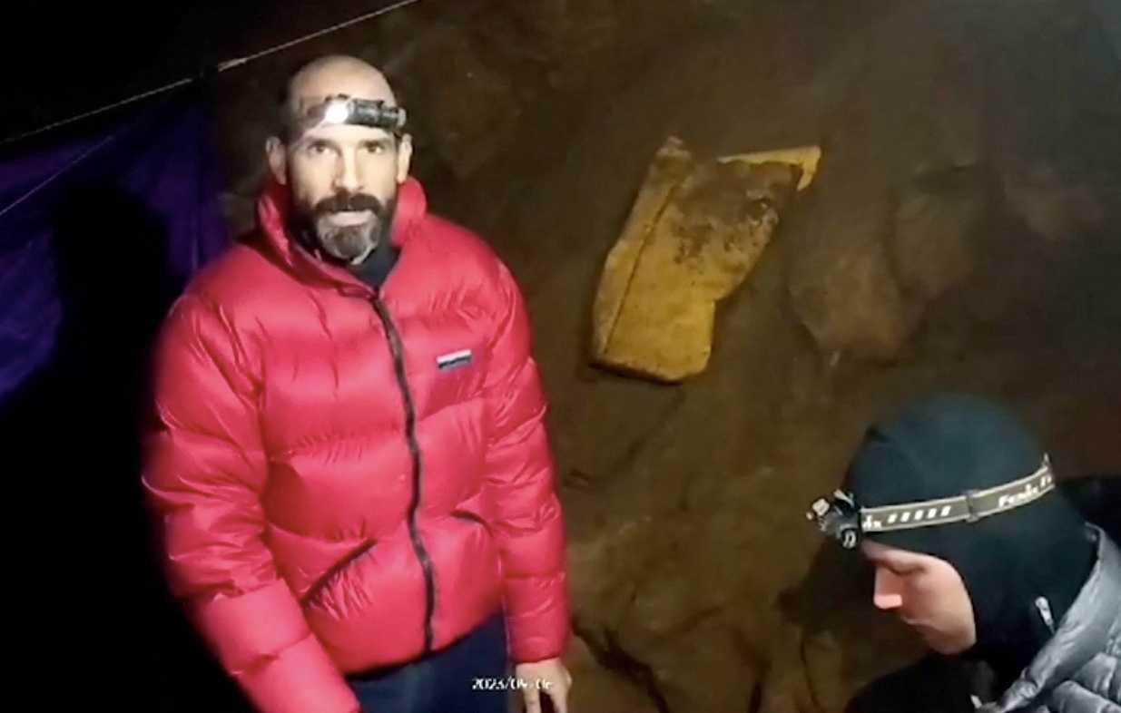 US explorer Mark Dickey is seen next to a rescuer inside the Morca Cave, near Anamur in Mersin province, southern Turkey Sept 6, in this screen grab taken from a video. Photo: Reuters
