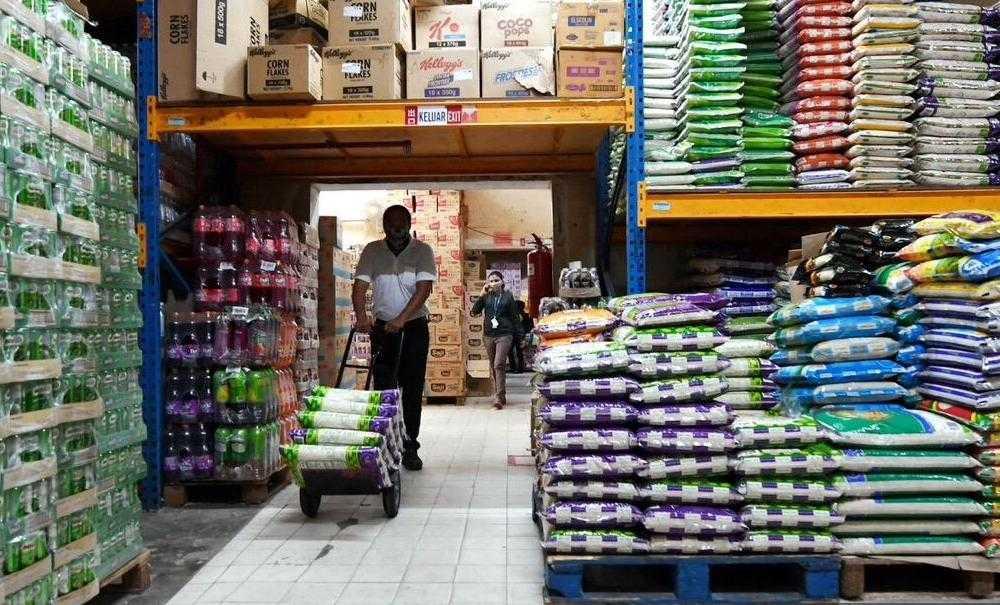 Economists say the suggestion to keep foreigners from buying local rice will not solve the problem in the long run. Photo: Bernama
