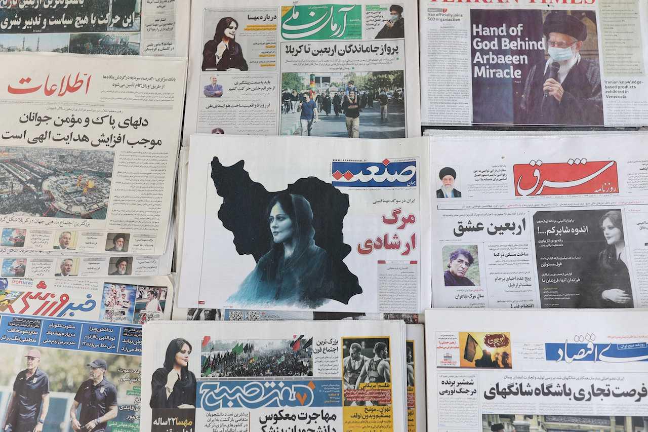 Newspapers, with a cover picture of Mahsa Amini, who died after being arrested by the Islamic republic's morality police, seen in Tehran, Iran, Sept 18, 2022. Photo: Reuters