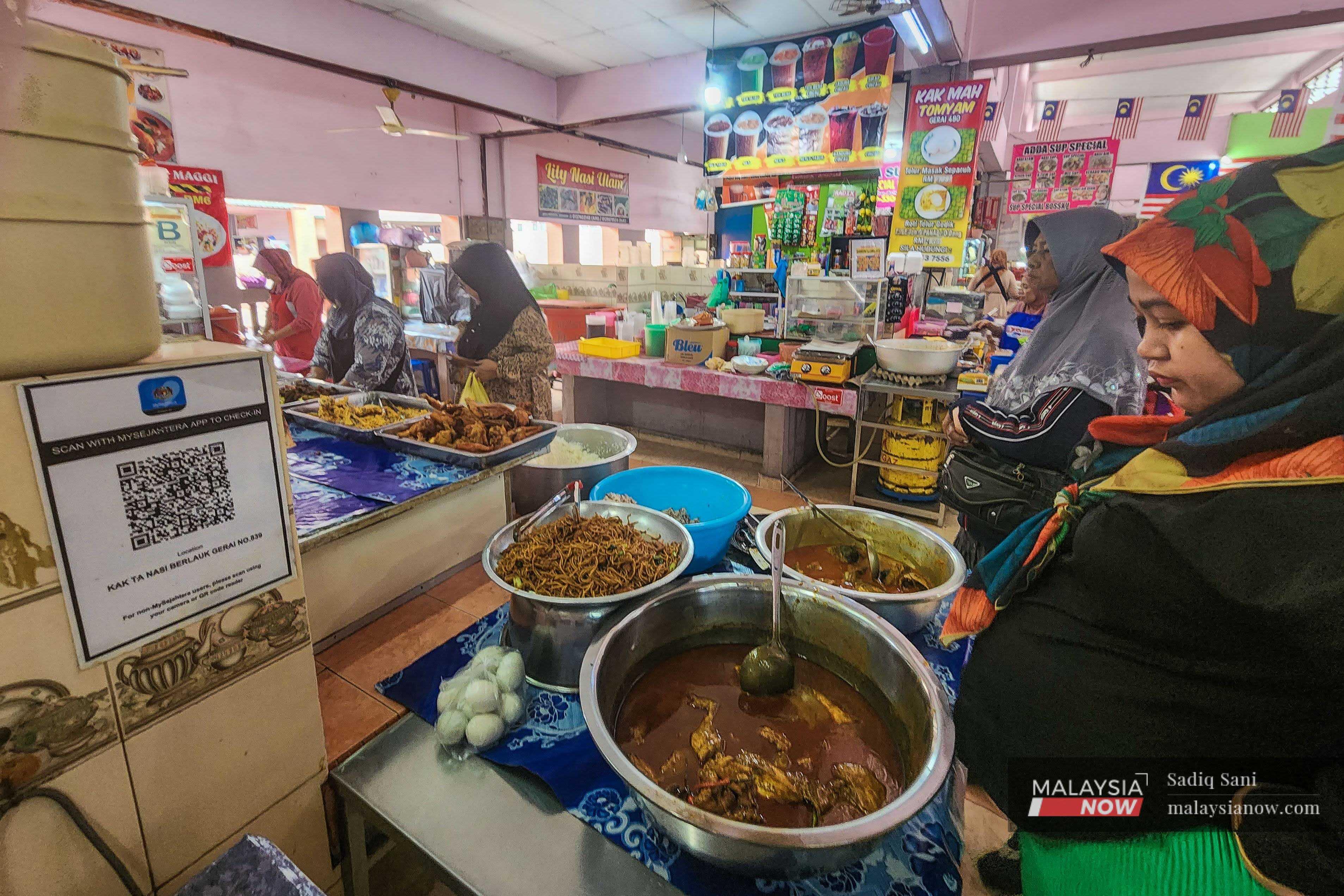 Customers queue at a restaurant in Kota Bharu, Kelantan. 
