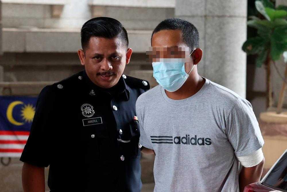 Muhammad Izzatul Shafik Mozahari was charged with reckless driving at the Putrajaya Magistrate's Court today. Photo: Bernama