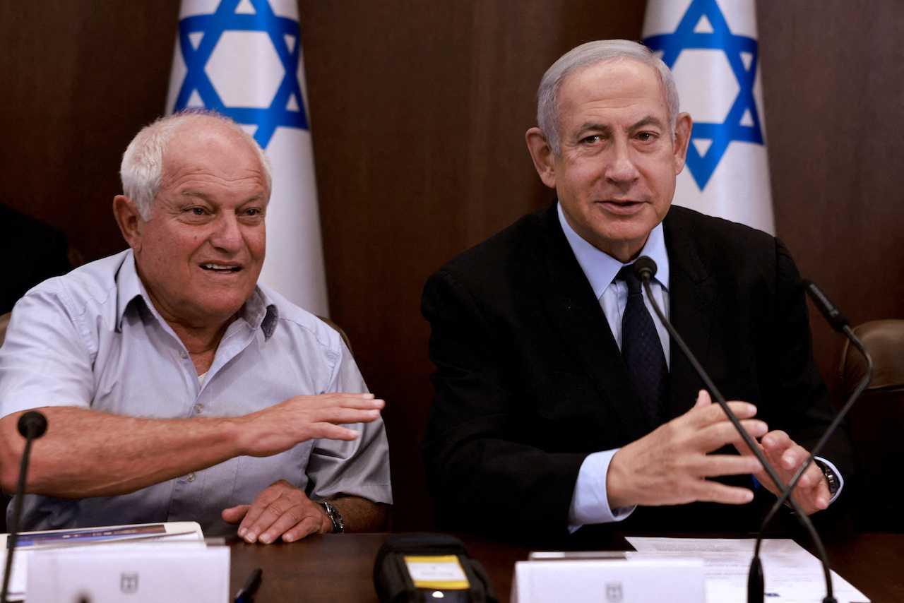 Israeli Prime Minister Benjamin Netanyahu (right) chairs a Cabinet meeting, flanked by Tourism Minister Haim Katz, in Jerusalem, Aug 27. Photo: Reuters