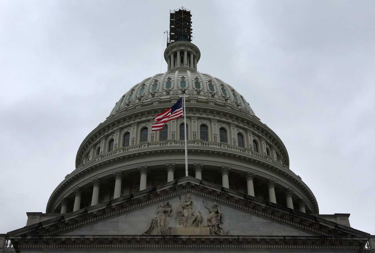 The dome of the US Capitol building is seen on a rainy day as the deadline to avert a government shutdown approaches in Washington, Sept 26. Photo: Reuters