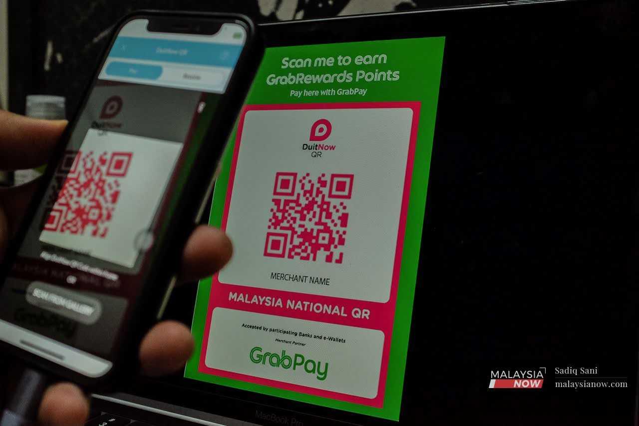 Traders have expressed reservations about an upcoming policy which would see them charged for transactions made through the DuitNow QR application.