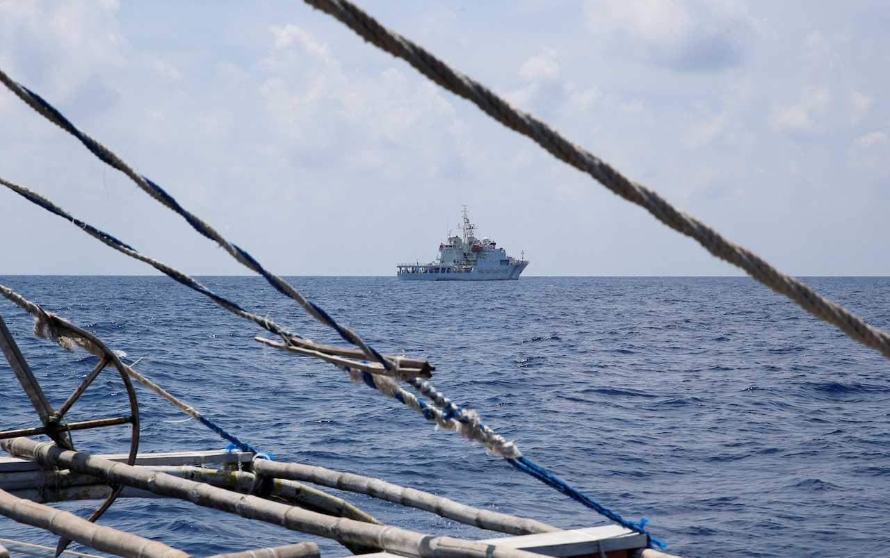A China Coast Guard ship is seen from a Philippine fishing boat at the disputed Scarborough Shoal, April 6, 2017. Photo: Reuters