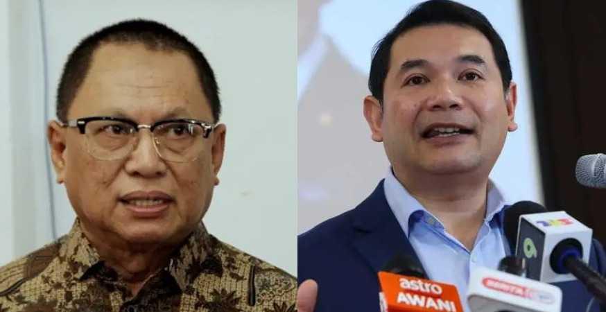 Ahli Majlis Kerja Tertinggi Umno Puad Zarkashi dan Menteri Ekonomi Rafizi Ramli.
