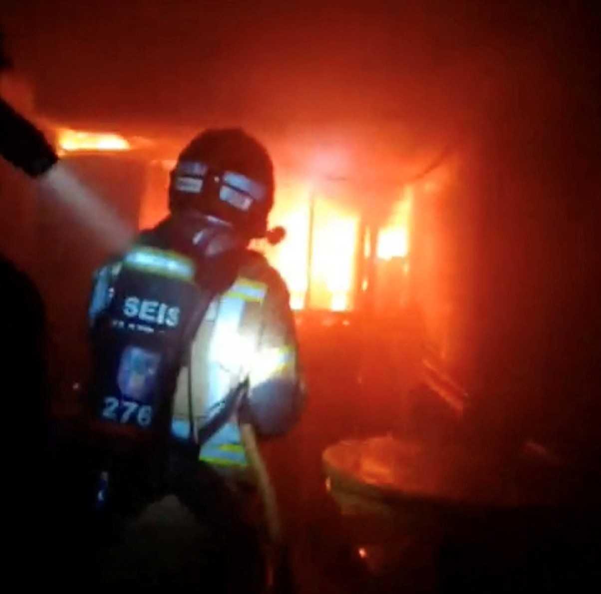 Firefighters work to control flames inside a nightclub in Murcia, Spain, Oct 1, in this screen grab obtained from a handout video. Photo: Reuters