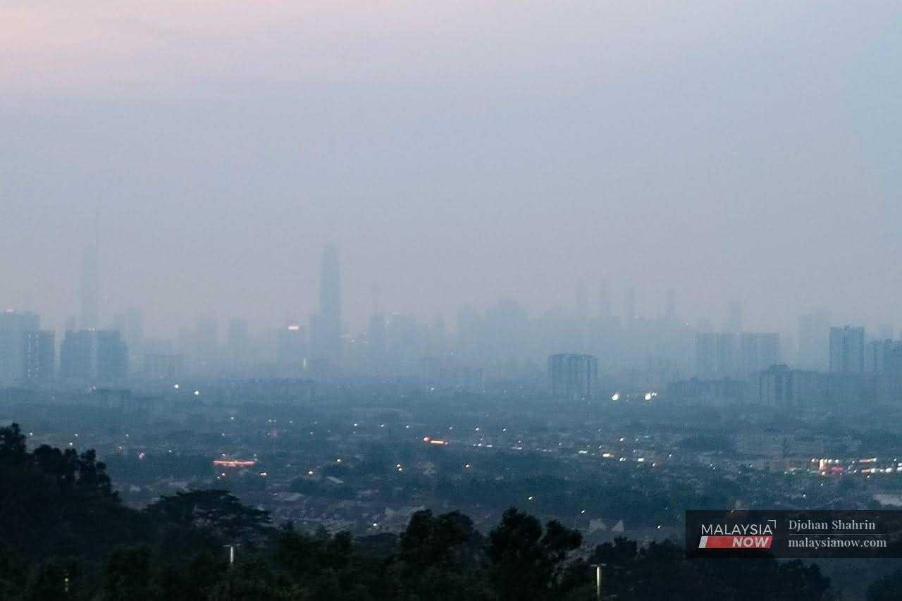 Haze blankets the Kuala Lumpur skyline in the capital city, Oct 2. 