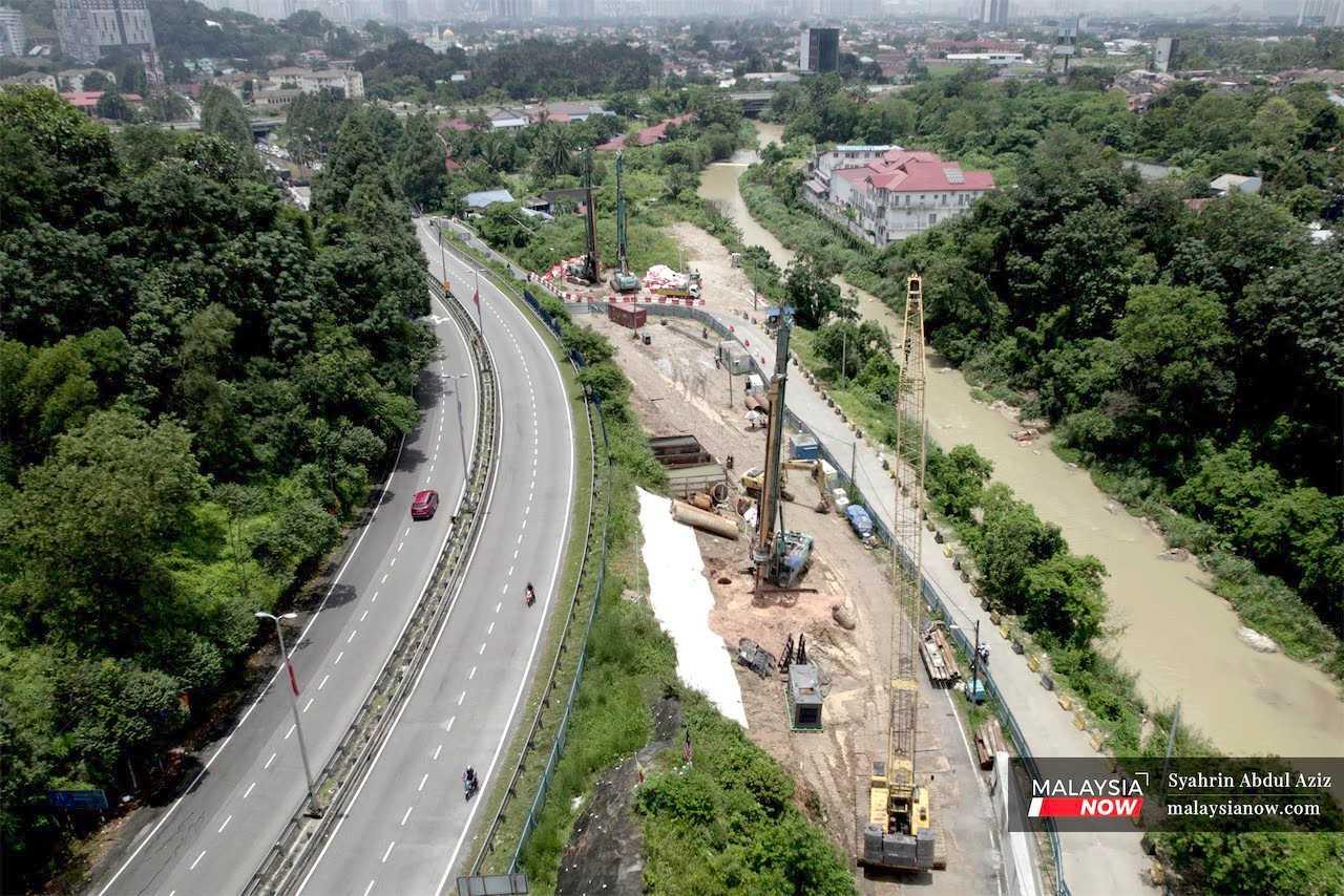 An aerial view of piling machinery in operation near Sungai Chinchin in Gombak, where the East Coast Rail Link project is expected to pass through.