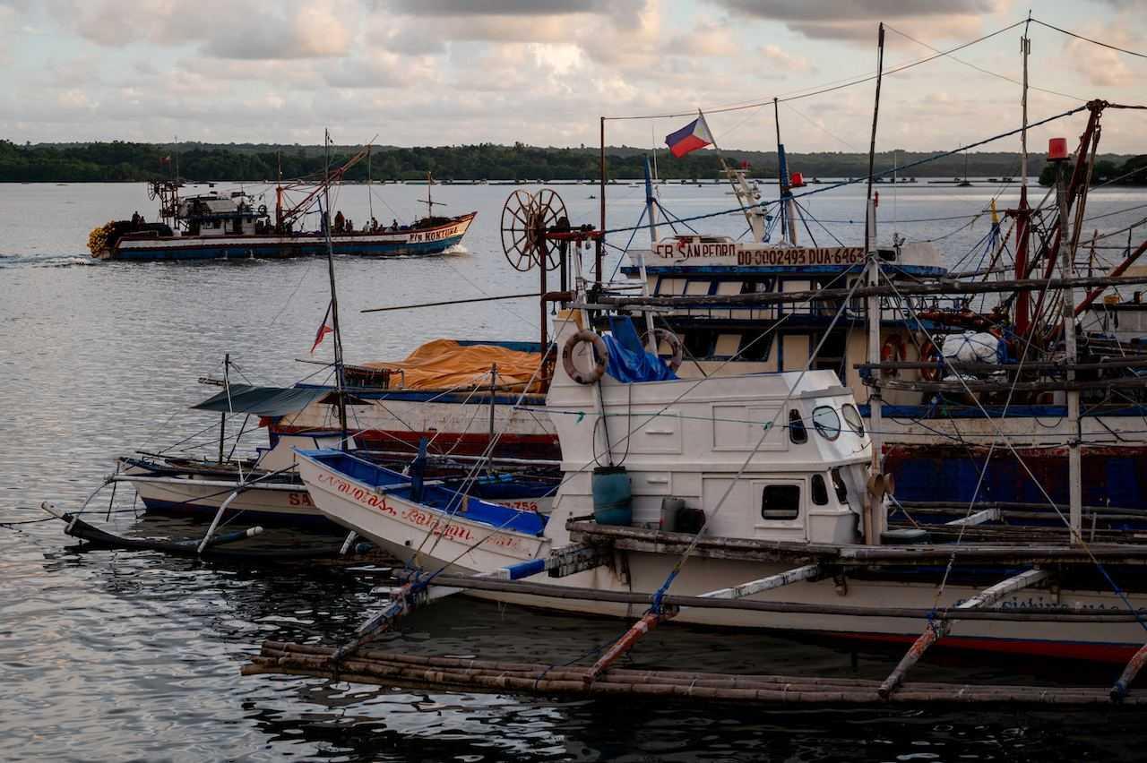A fishing boat departs from a port in Masinloc, Zambales province, Philippines, Sept 26. Photo: Reuters