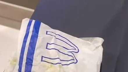 A blue and white burger wrapper by a McDonald's outlet in the US which has sparked an outcry on social media.