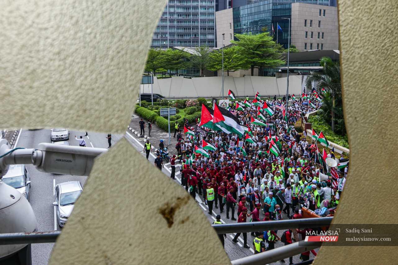 A group of protesters make their way towards the US embassy, a focal point of pro-Palestinian protests in Malaysia.