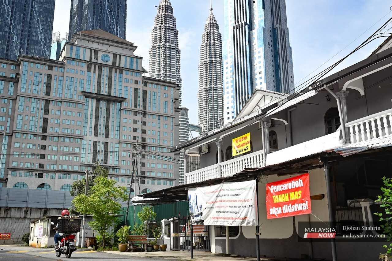 Banners like this began appearing in Kampung Sungai Baru as residents intensified efforts to prevent their land from being taken by developers.