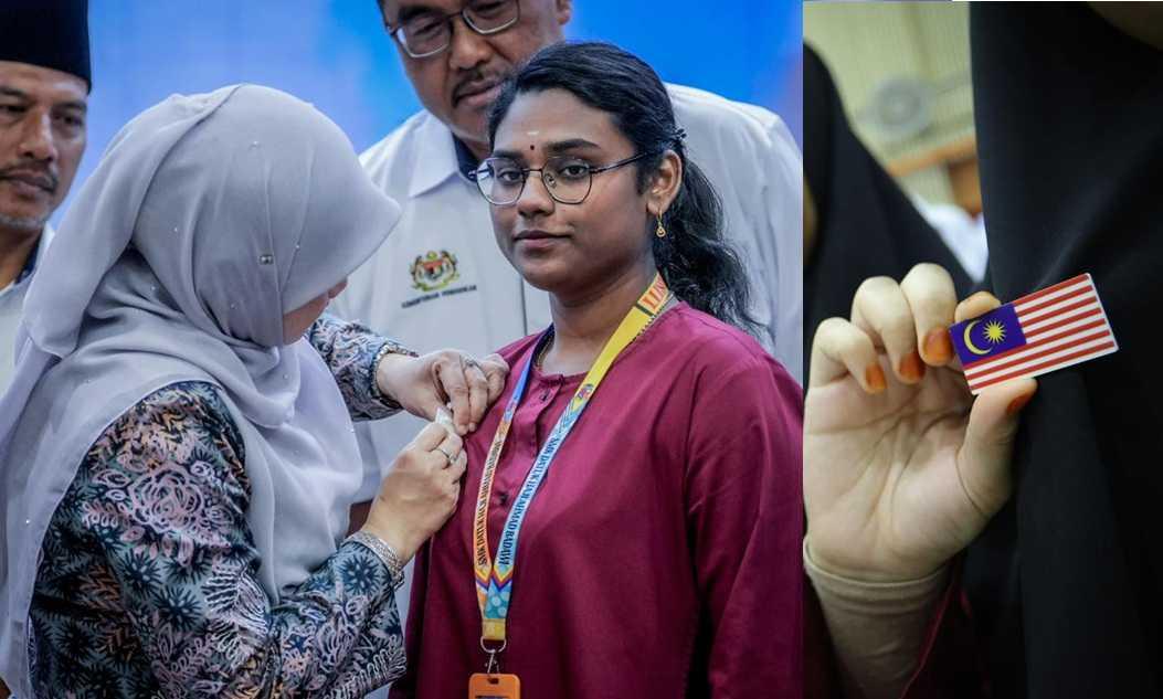 Fadhlina Sidek pinning a Jalur Gemilang badge on a secondary school student. The government spent a whopping RM8.4 million to distribute the badges to more than five million students nationwide.
