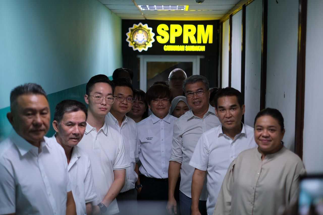 Warisan assemblymen after handing over their memorandum to MACC today.