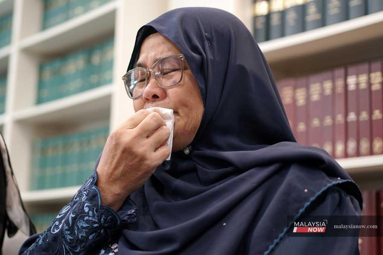 Josmah Duim, the mother of Abdul Hamid Taib, breaks down during a press conference in Petaling Jaya, July 27, 2026.