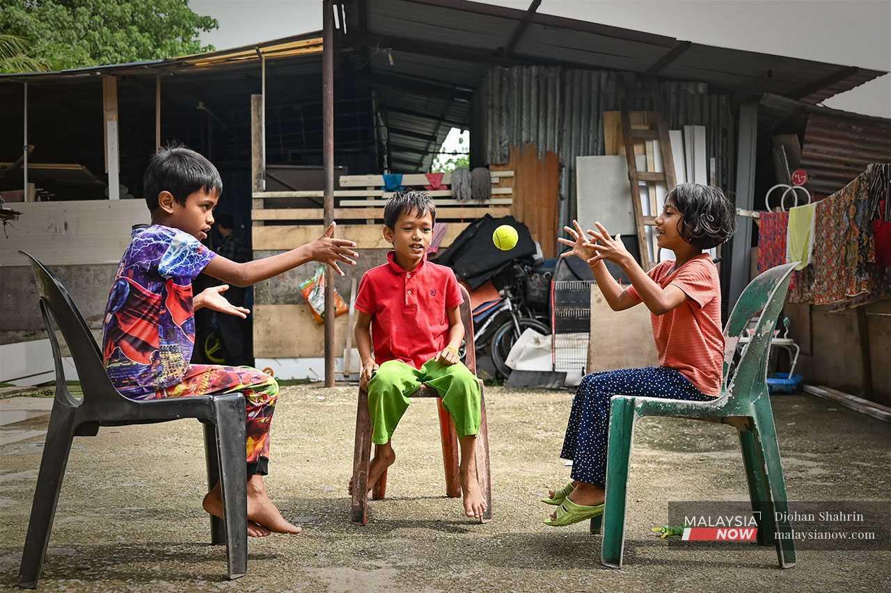 Children of Rohingya refugees play outside a settlement in Ampang, Selangor, in this picture taken in 2025.