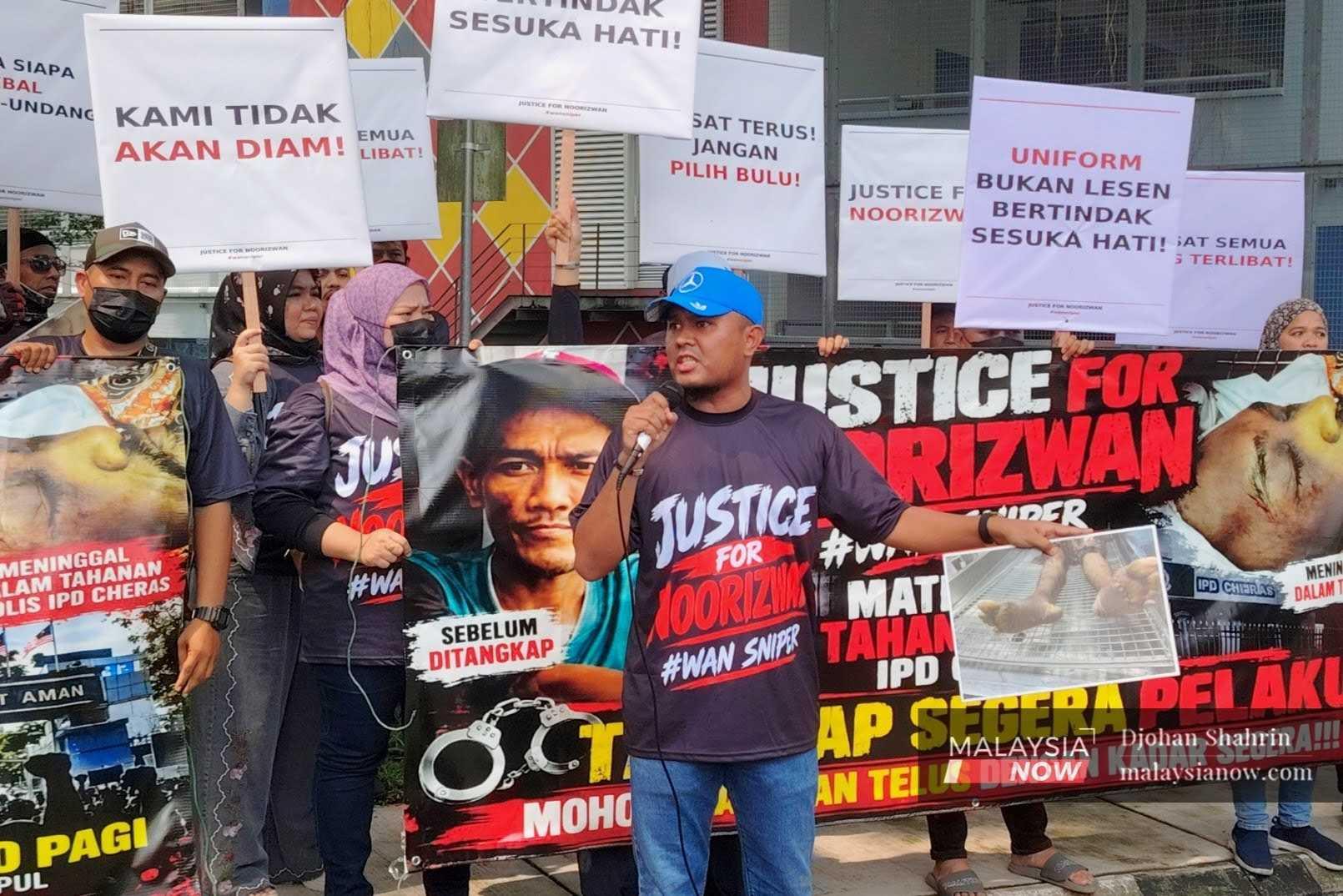 Nooranis Zulkefly speaks at a protest outside the Bukit Aman police headquarters on Oct 17, 2026, demanding a murder investigation into the death of his brother Noorizwan on Oct 1.