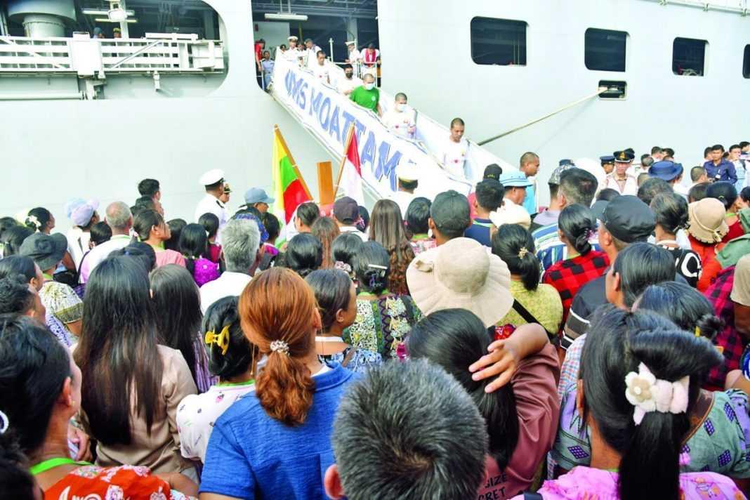 Deportees from Malaysia arrive at Thilawa Port in Yangon on Oct 4, 2026 in this picture shared by the Myanmar regime.