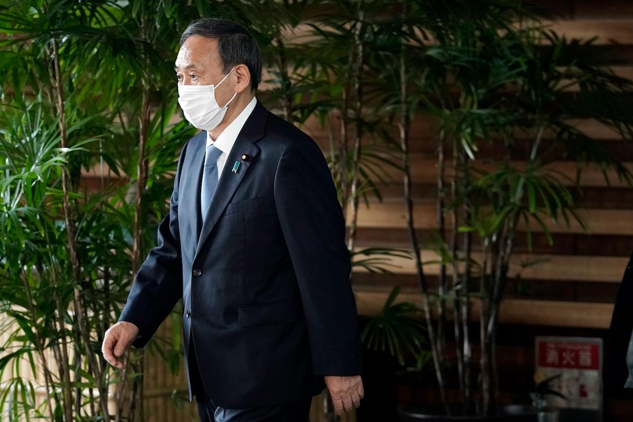 Former chief cabinet secretary Yoshihide Suga walks out of the Prime Minister's Office in Tokyo after a Cabinet meeting on Sept 16, 2020. Photo: AP
