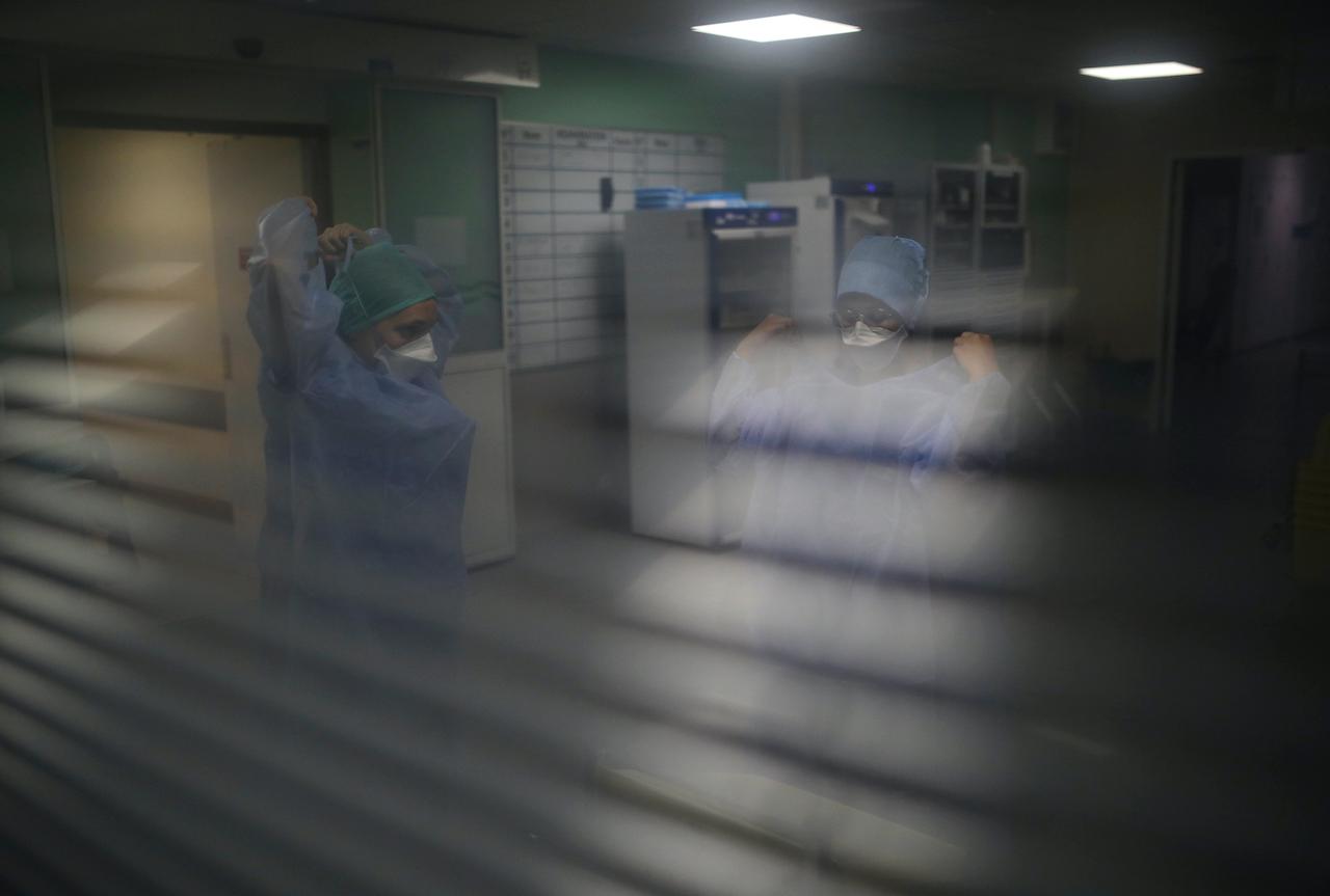 Health workers don protective gear in a hospital in Marseille, southern France, on Sept 10. Photo: AP