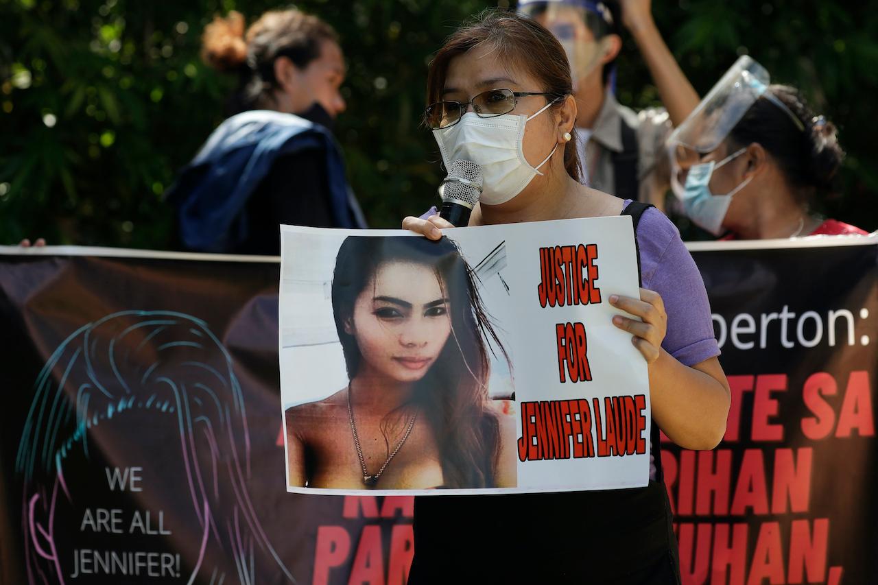 A protester holds a slogan with a photo of transgender Filipino woman Jennifer Laude during a rally in Quezon city, Philippines, Sept 11, 2020. Photo: AP