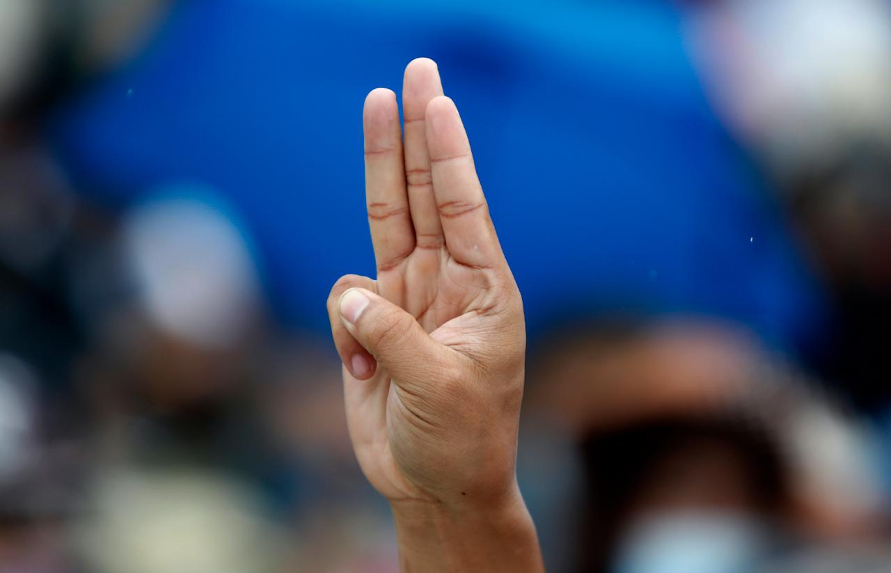 A pro-democracy activist raises a three-fingered salute, a symbol of resistance, during a protest in Bangkok, Thailand on Sept 19. The monarchy is currently facing unprecedented calls for reform. Photo: AP