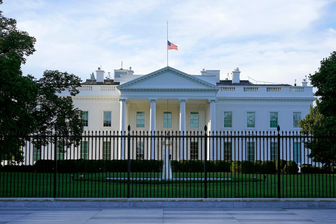 The US flag flies at half-mast over the White House in Washington in this file picture taken on Sept 19. Photo: AP
