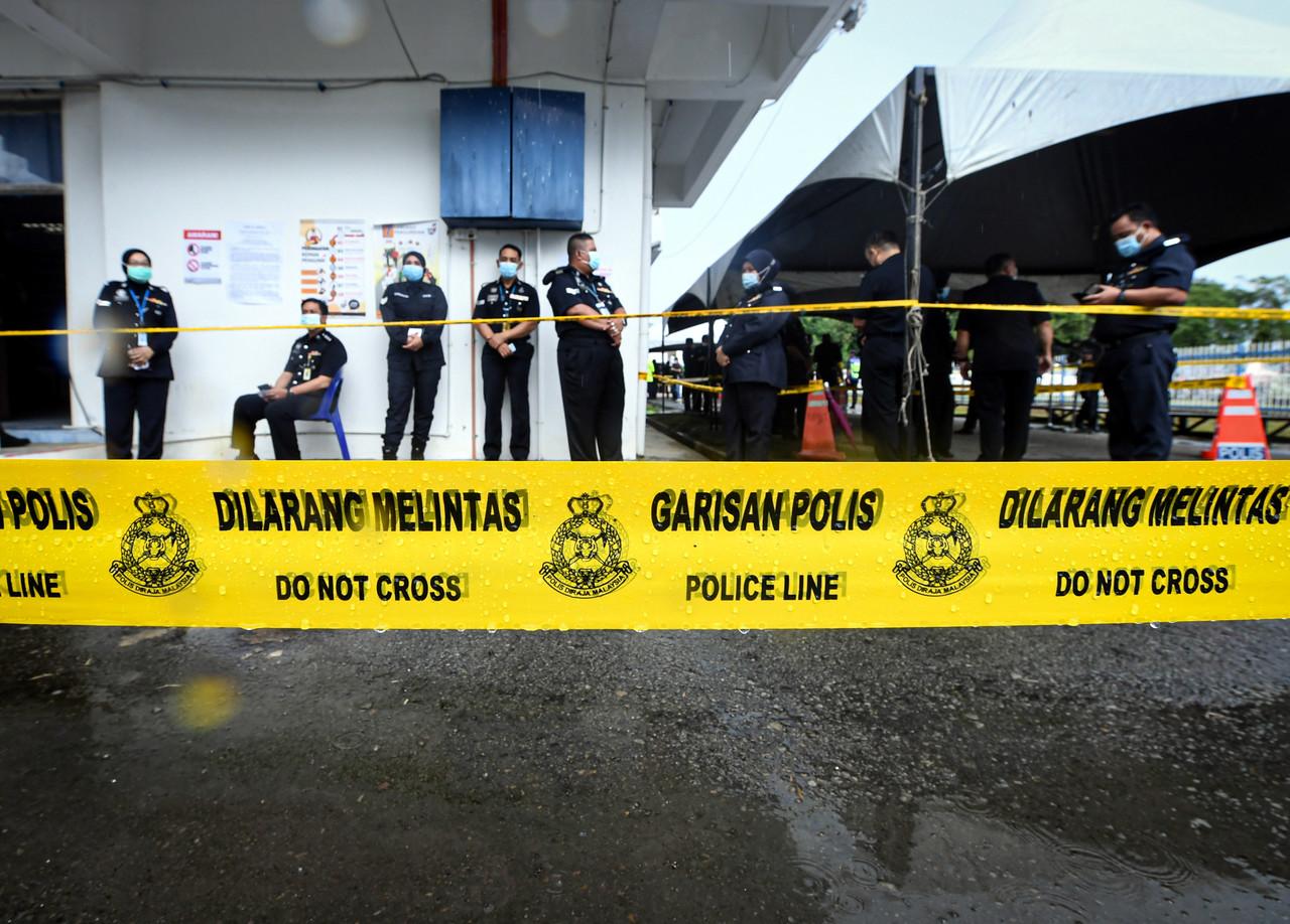 Officers wait in line for early voting at the state police headquarters in Kota Kinabalu, Sabah, today. Photo: Bernama