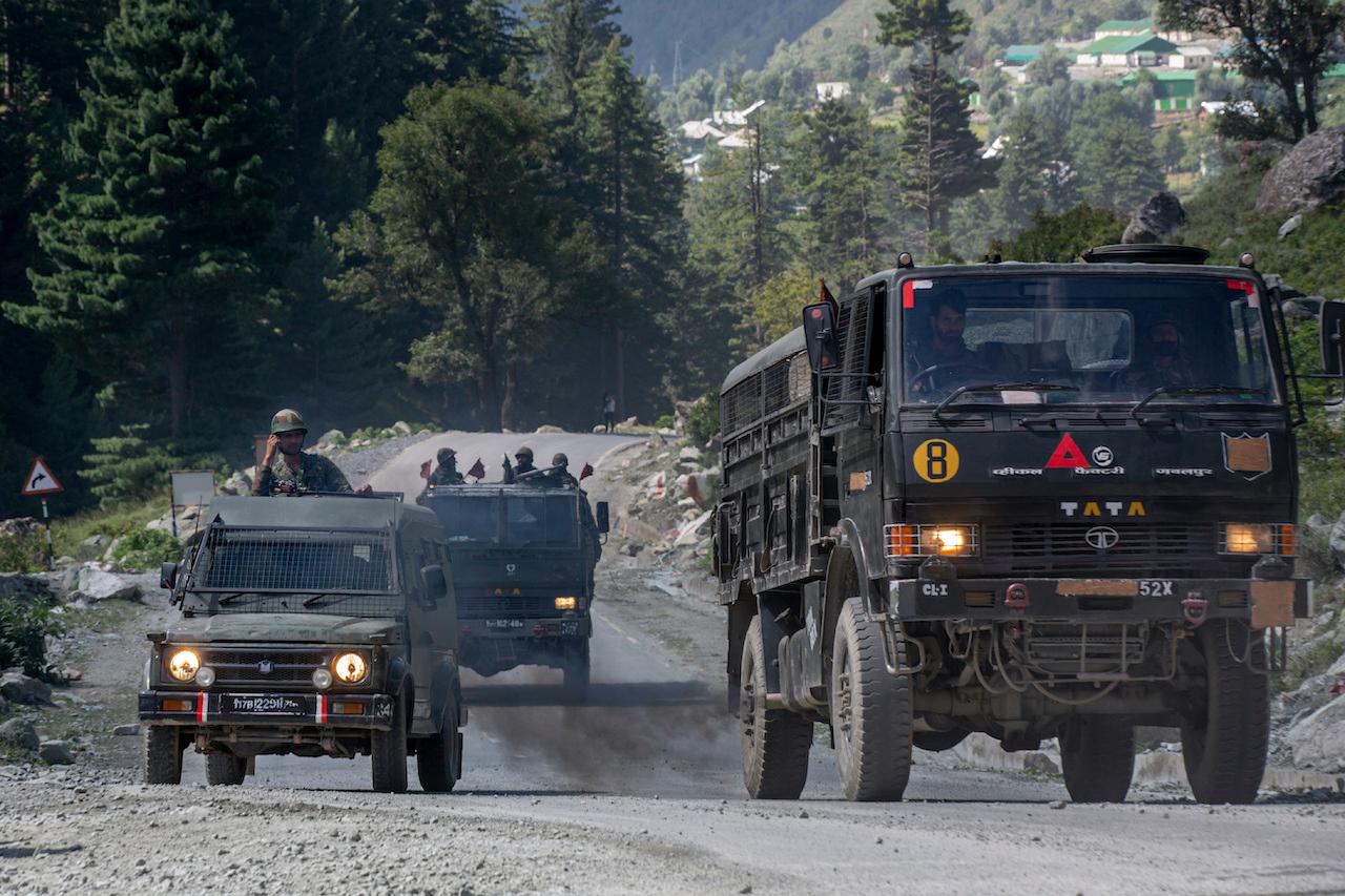 An Indian army convoy moves on the Srinagar-Ladakh highway at Gagangeer, northeast of Srinagar, Indian-controlled Kashmir, on Sept 9. Photo: AP
