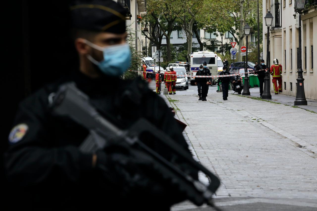 A French gendarme guards a street after a knife attack near the former offices of satirical newspaper Charlie Hebdo on Sept 25 in Paris. Photo: AP