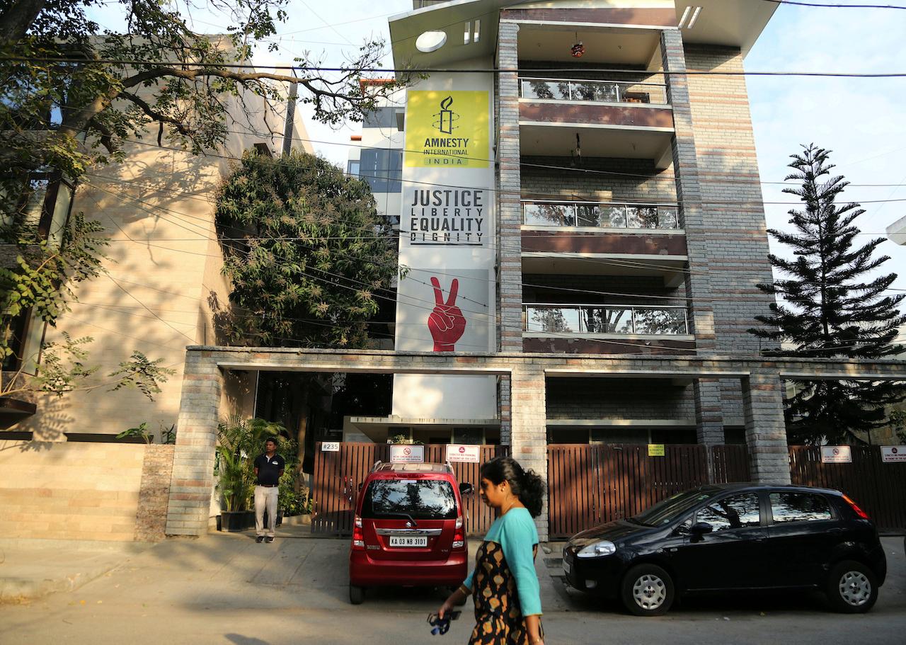 A woman walks past the Amnesty International India headquarters in Bangalore in this Feb 5, 2019 file picture. Photo: AP