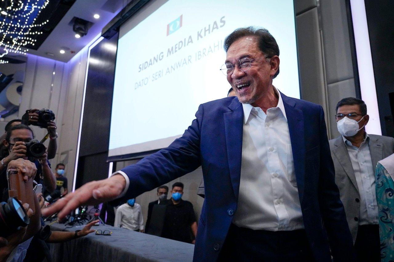 PKR president Anwar Ibrahim leaves after his press conference in Kuala Lumpur on Sept 23 at which he said he had secured a majority in Parliament to form a new government. Photo: AP