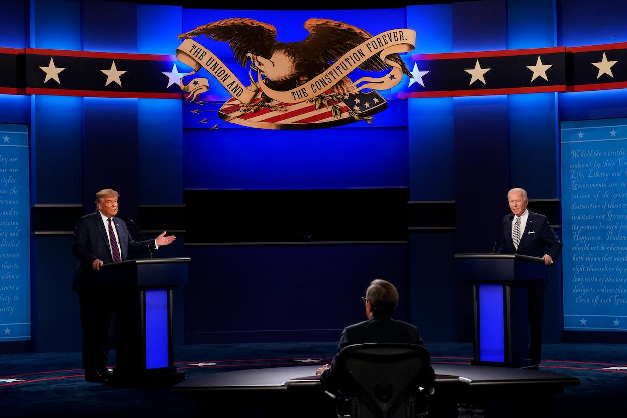 Moderator Chris Wallace of Fox News listens as President Donald Trump and Democratic candidate former vice-president Joe Biden participate in the first presidential debate on Sept 29. Photo: AP
