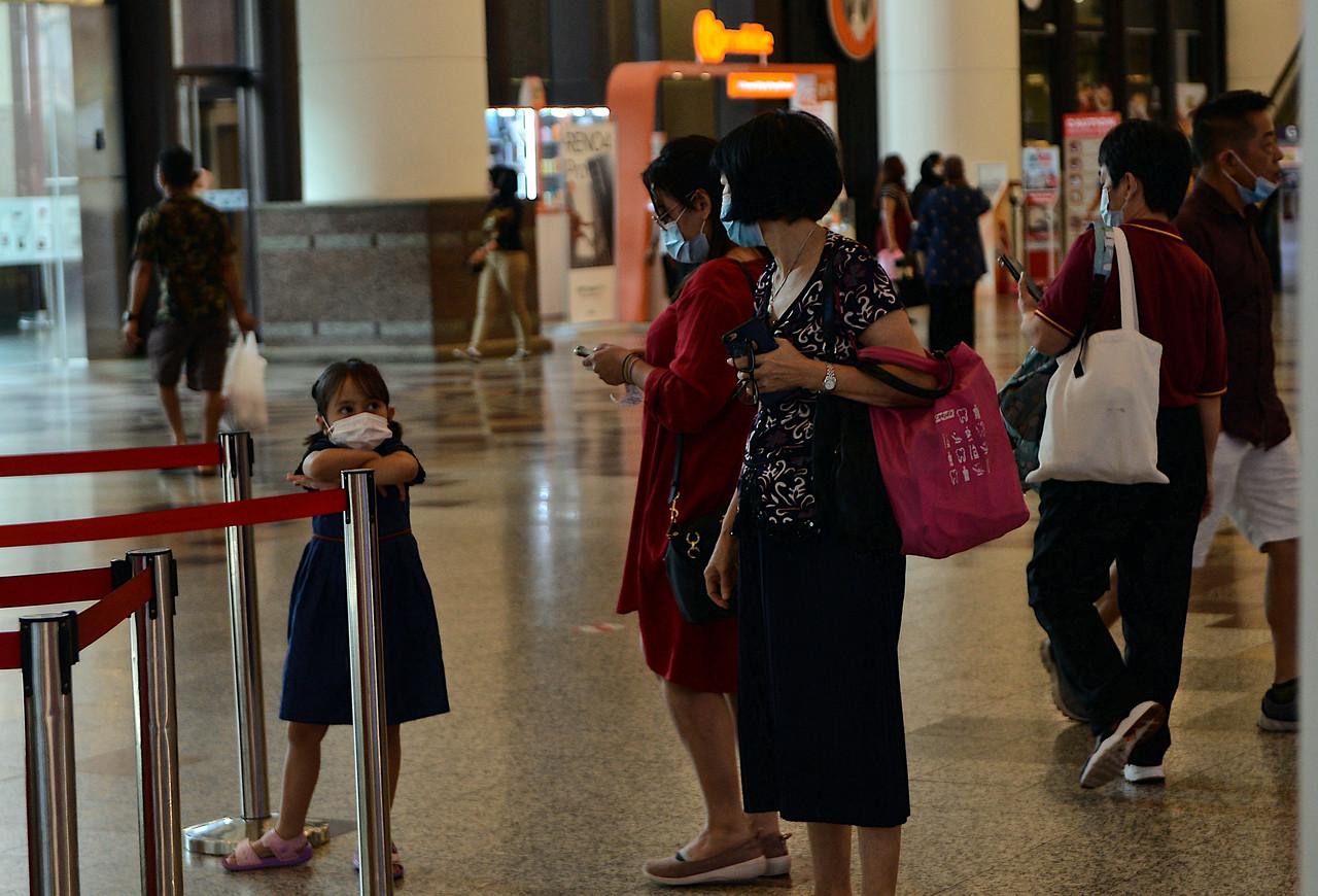 SOPs include physical distancing and the wearing of masks in public areas. Photo: Bernama