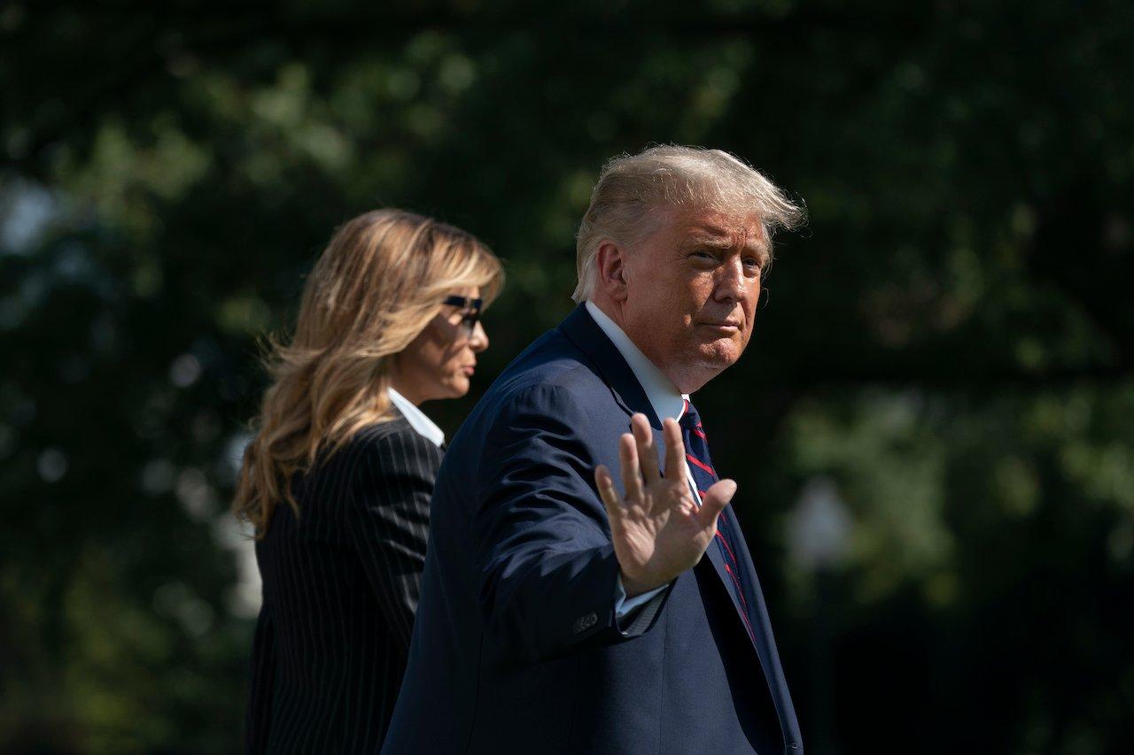 US President Donald Trump and first lady Melania Trump walk to board Marine One at the White House, Sept 29, in Washington. Photo: AP