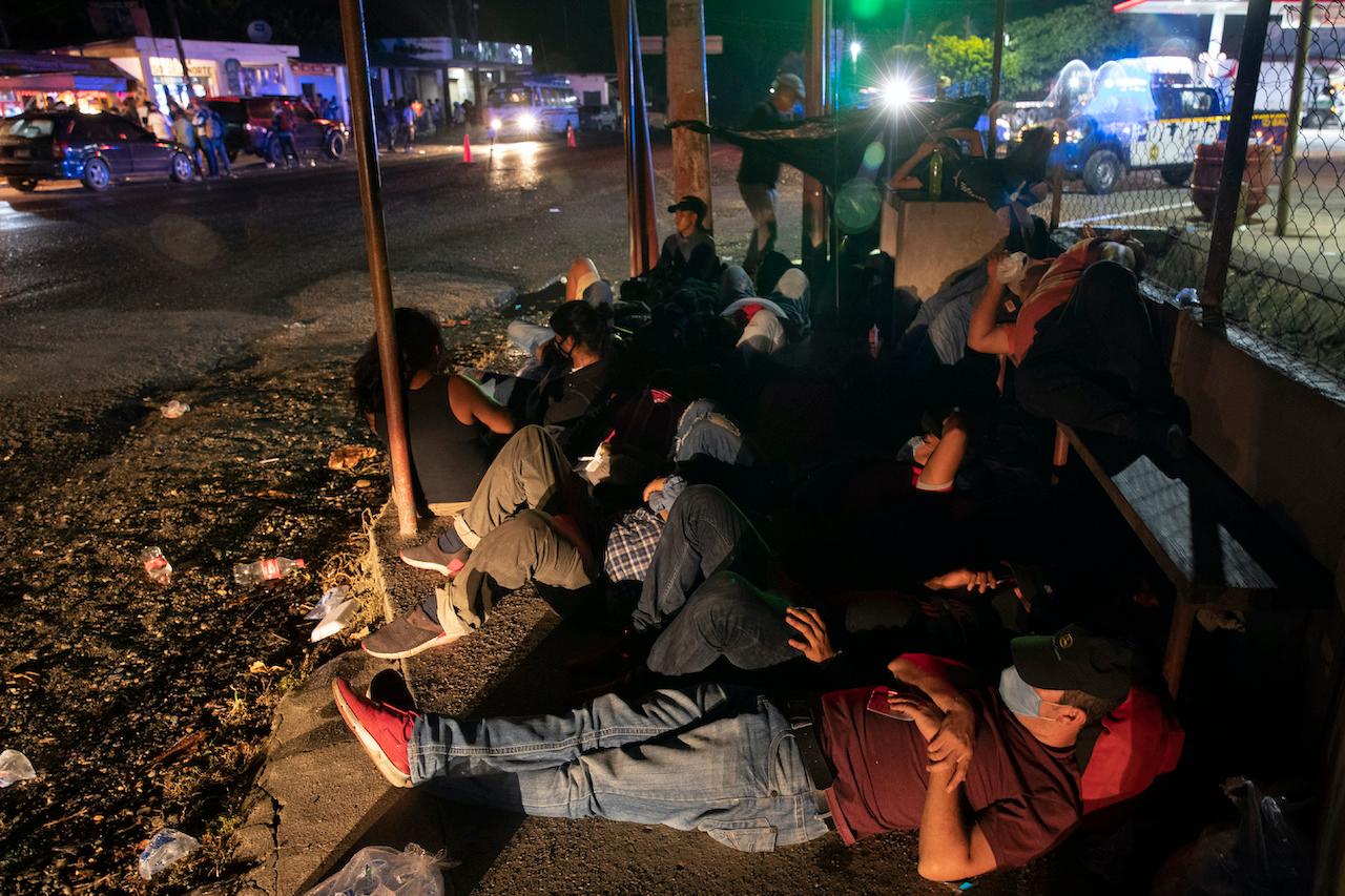 A group of Honduran migrants rest in Morales, Guatemala on Oct 1. Photo: AP