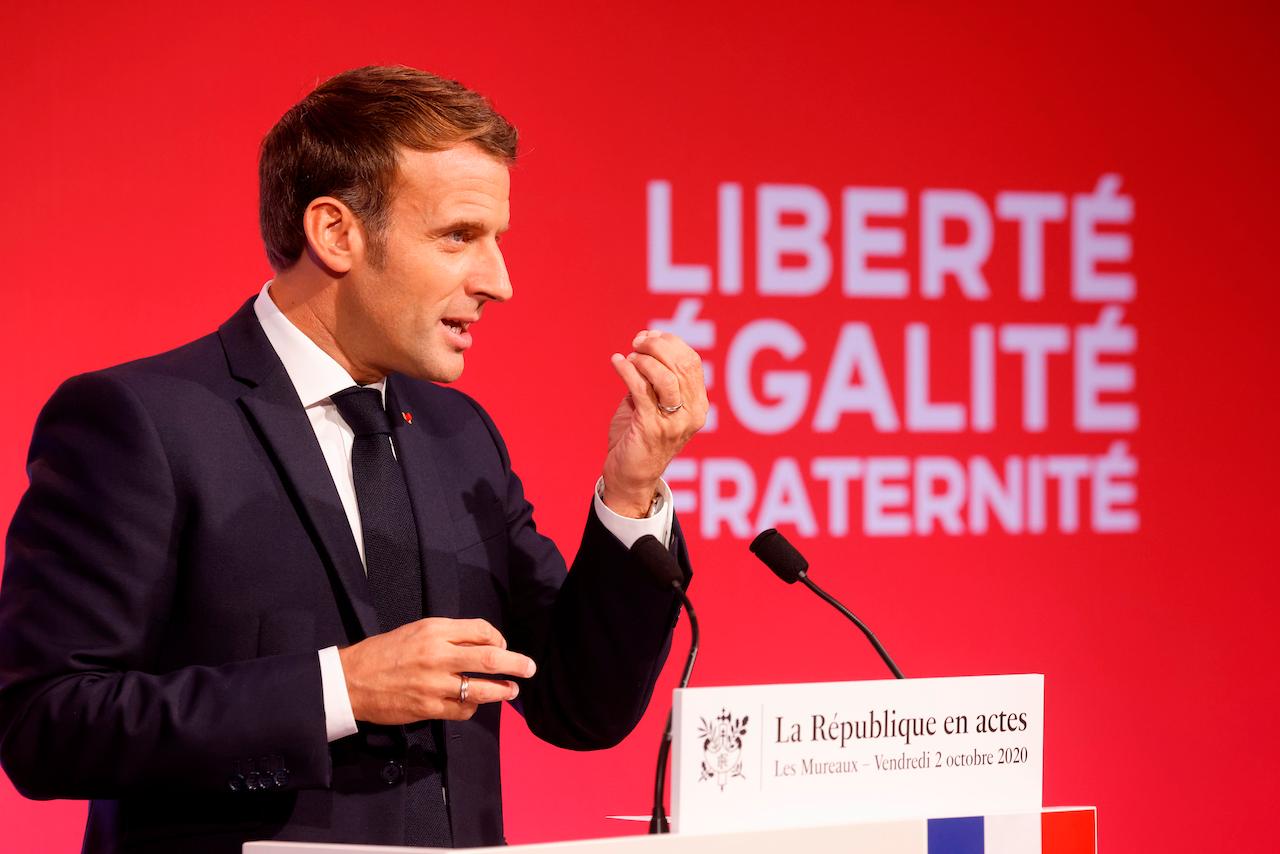 French President Emmanuel Macron delivers a speech to present his strategy to fight separatism on Oct 2 in Les Mureaux, outside Paris. Photo: AP