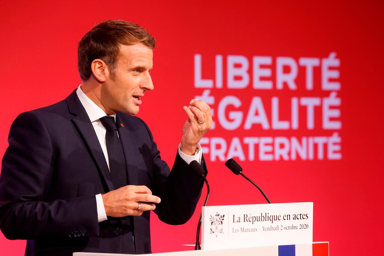 French President Emmanuel Macron delivers a speech to present his strategy to fight separatism on Oct 2 in Les Mureaux, outside Paris. Photo: AP