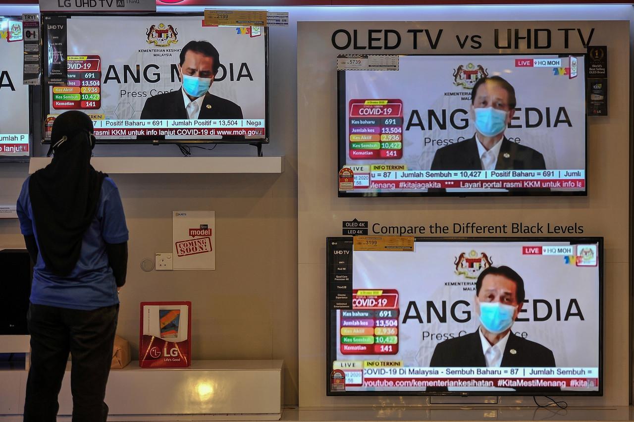 Health director-general Dr Noor Hisham Abdullah announces today's Covid-19 numbers, the highest since the pandemic reached Malaysia earlier this year. Photo: Bernama
