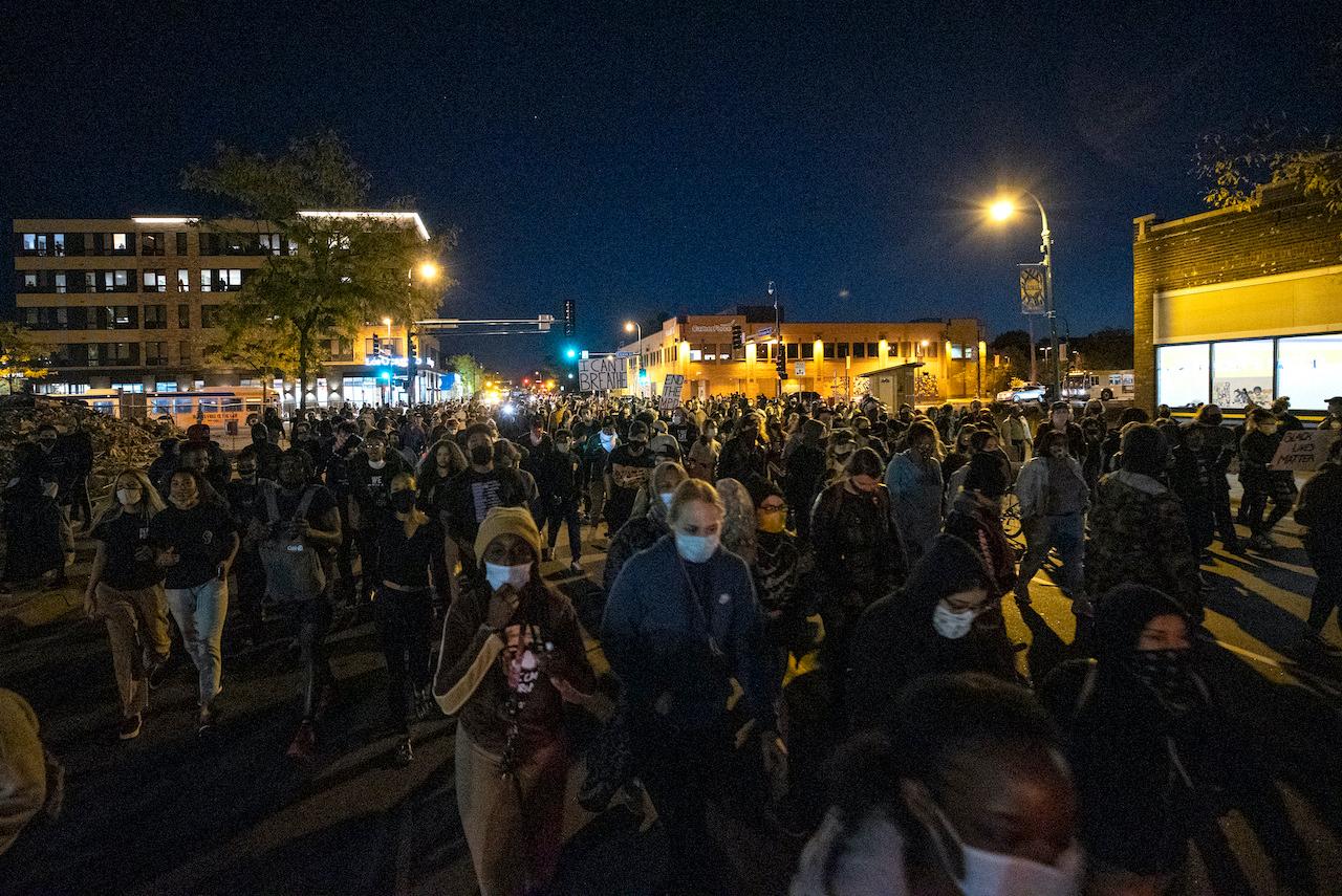 Demonstrators block an intersection in Minneapolis on Oct 7 after Derek Chauvin, the former police officer charged with murder in the death of George Floyd, posted bail and was released from prison. Photo: AP